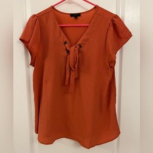 mine • size L • orange short sleeve blouse with lace up tie